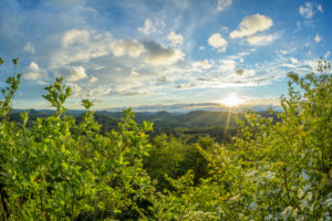 Landscape with sun in spring, Castle Lindelbrunn, Vorderweidenthal, Pfälzerwald, Südliche Weinstraße District, Rhineland-Palatinate, Germany Landscape with sun in spring, Castle Lindelbrunn, Vorderweidenthal, Pfälzerwald, Südliche Weinstraße District, Rhineland-Palatinate, Germany